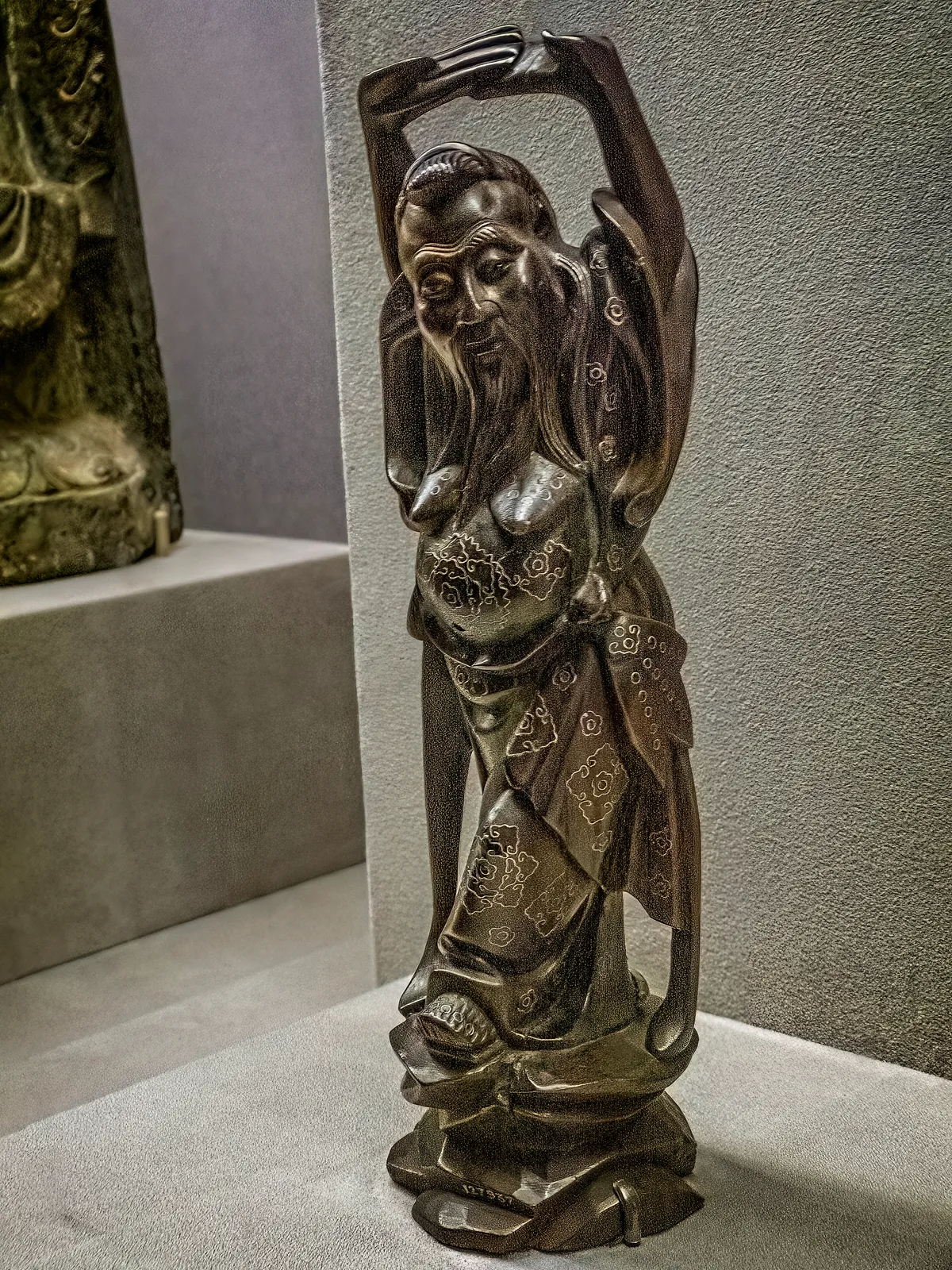 Wooden figurine of Zhongli Quan with silver inlay.
