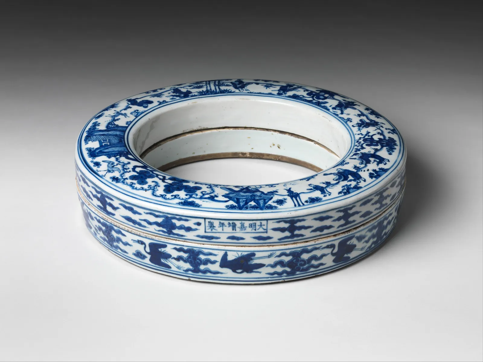 Blue and white porcelain box painted with Daoist immortals.