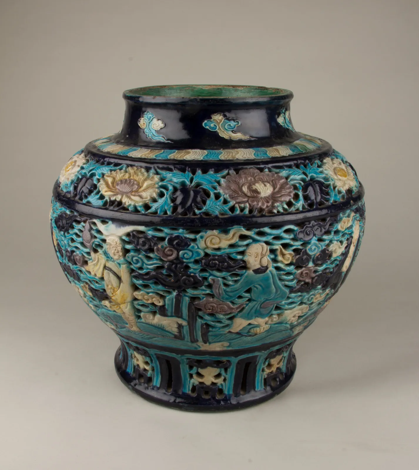 Fahua ware jar decorated with relief scenes of the Eight Immortals.