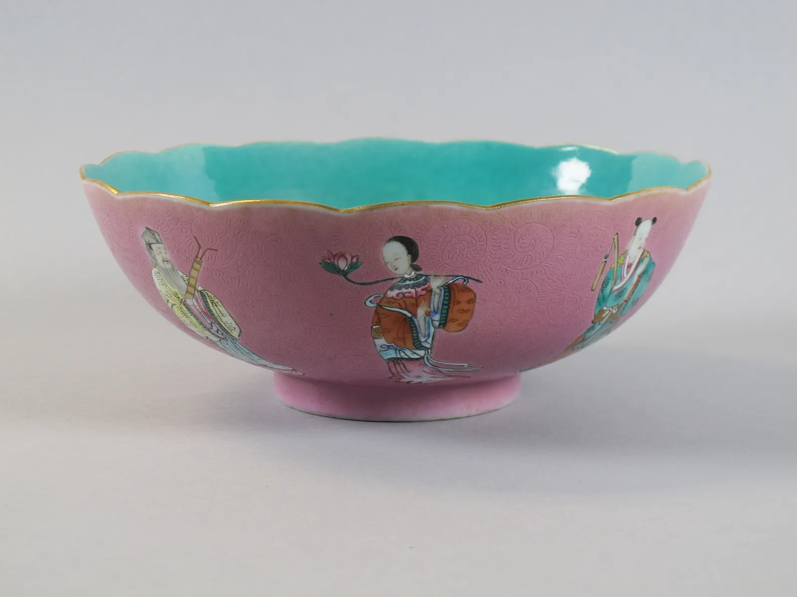 Porcelain bowl with the Eight Immortals over a pink ground, rotation view 1.