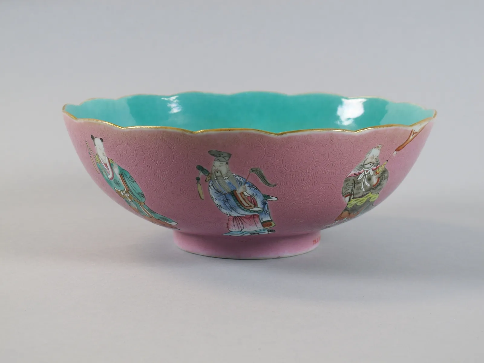 Porcelain bowl with the Eight Immortals over a pink ground, rotation view 3.