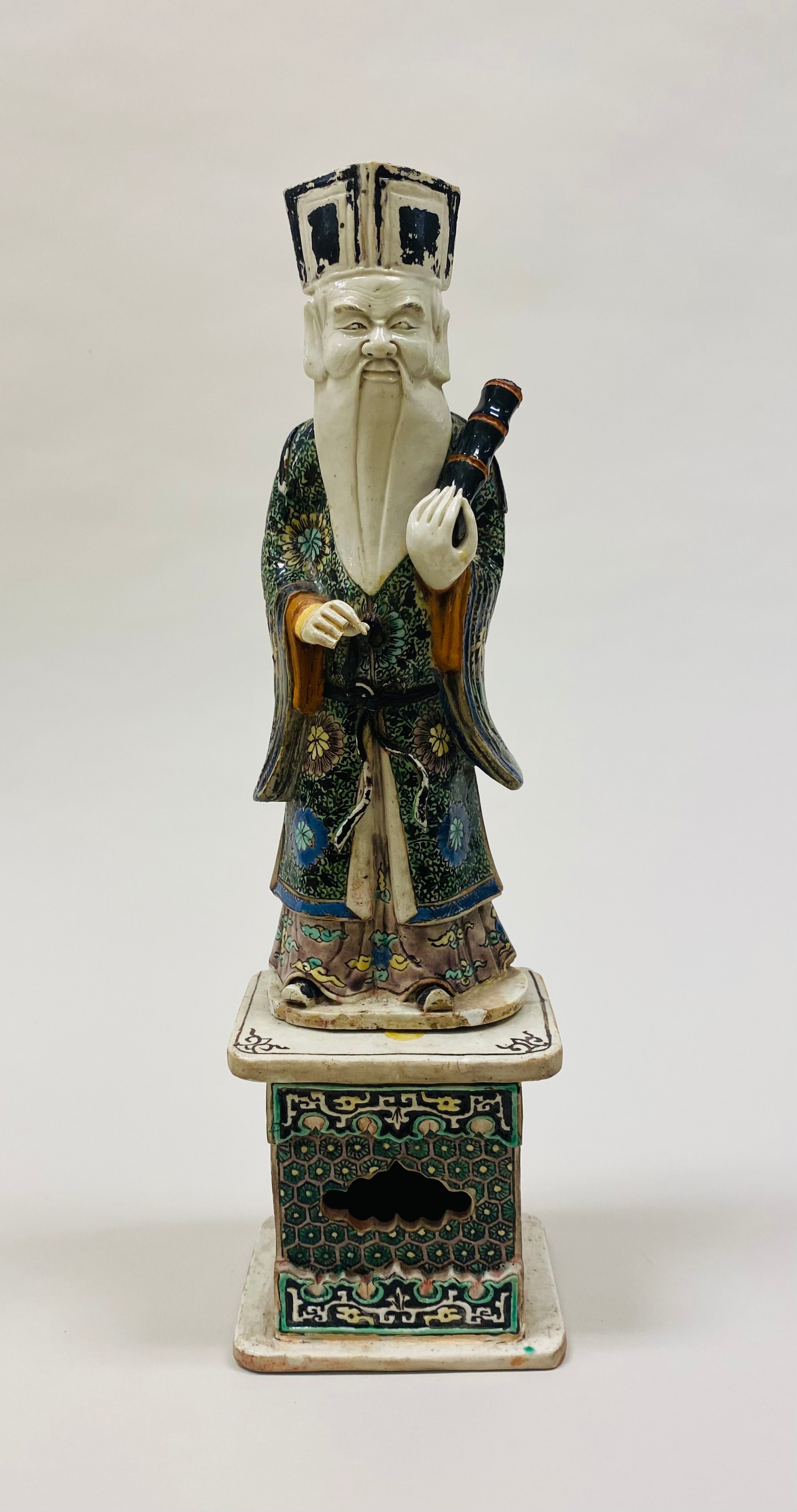 Polychrome ceramic figure of Zhang Guolao, one of the Eight Immortals.