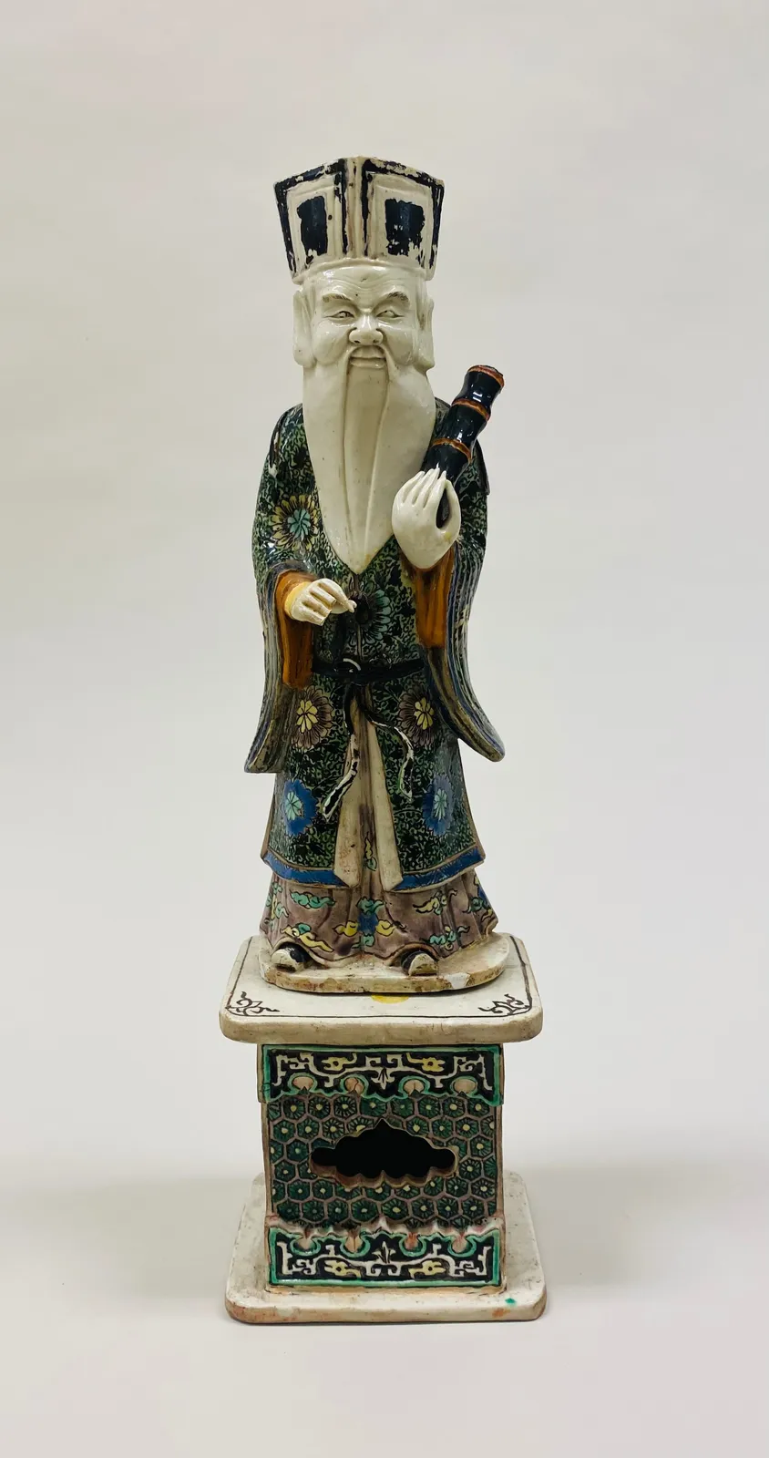 Polychrome ceramic figure of Zhang Guolao, one of the Eight Immortals.