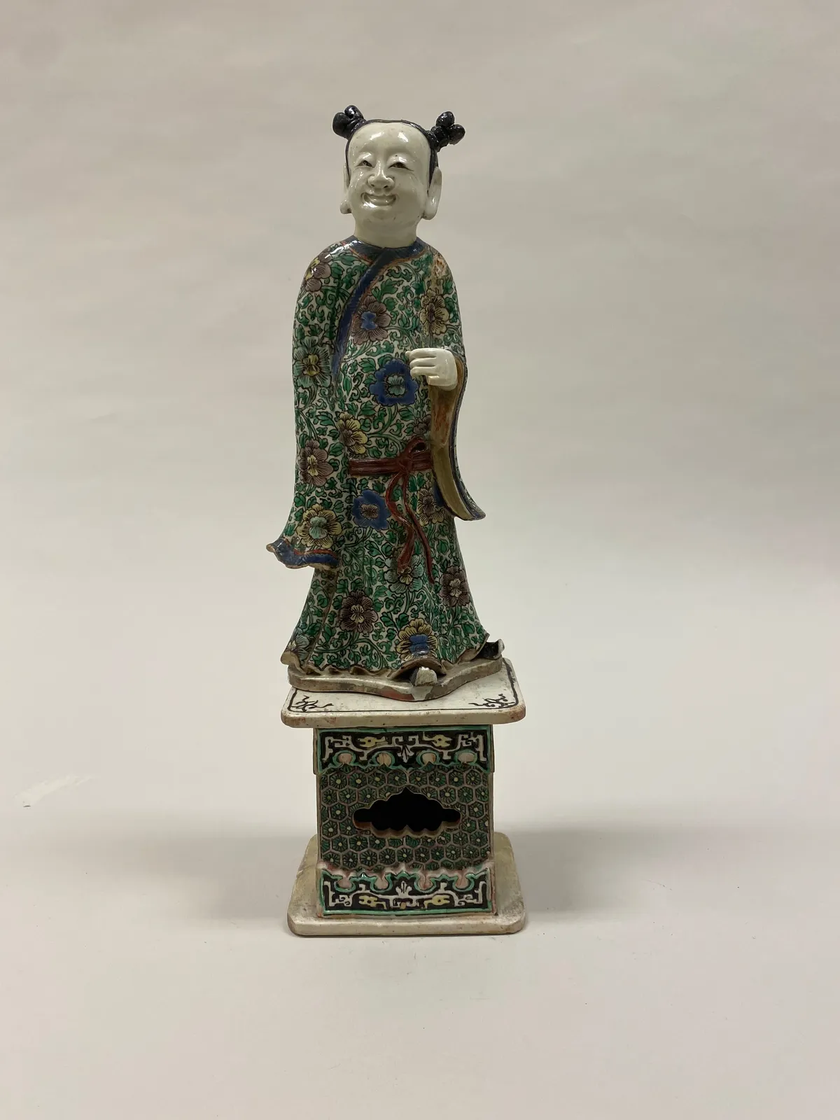 Polychrome ceramic figure of Han Xiangzi, one of the Eight Immortals.